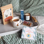 Teddy’s Wish Community Package Out Box Tea cross stitch on bed 600x600 SHARPER.jpg