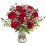 Large, round bouquet of red roses and wax flower with greenery