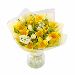 Bouquet with various, mixed seasonal yellow, cream and white flowers and green fillers