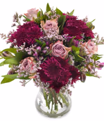 Medium, round bouquet of lavender, lilac roses, purple alstroemeria, purple spray chrysanthemums and purple chrysanthemums