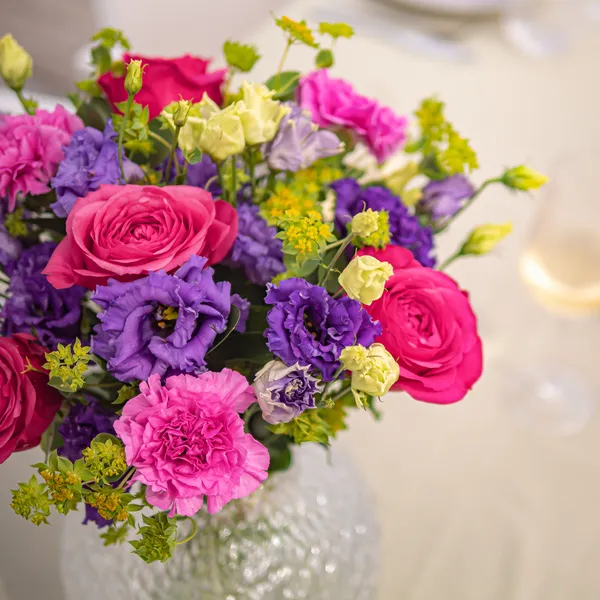Bouquet of pink roses and purple carnations