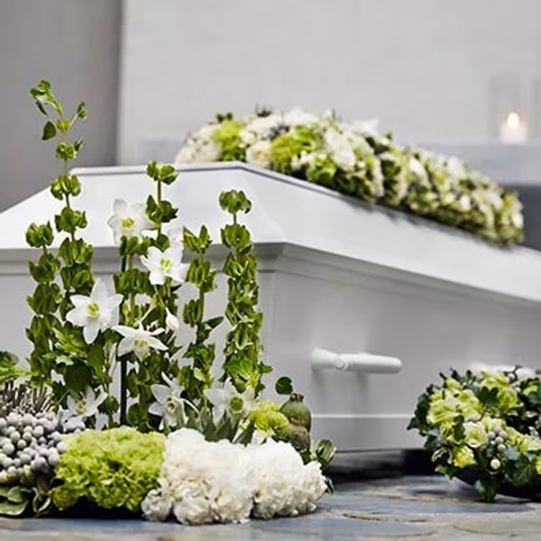flower arrangements on a coffin