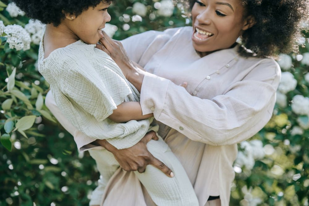 A mum holding her daughter