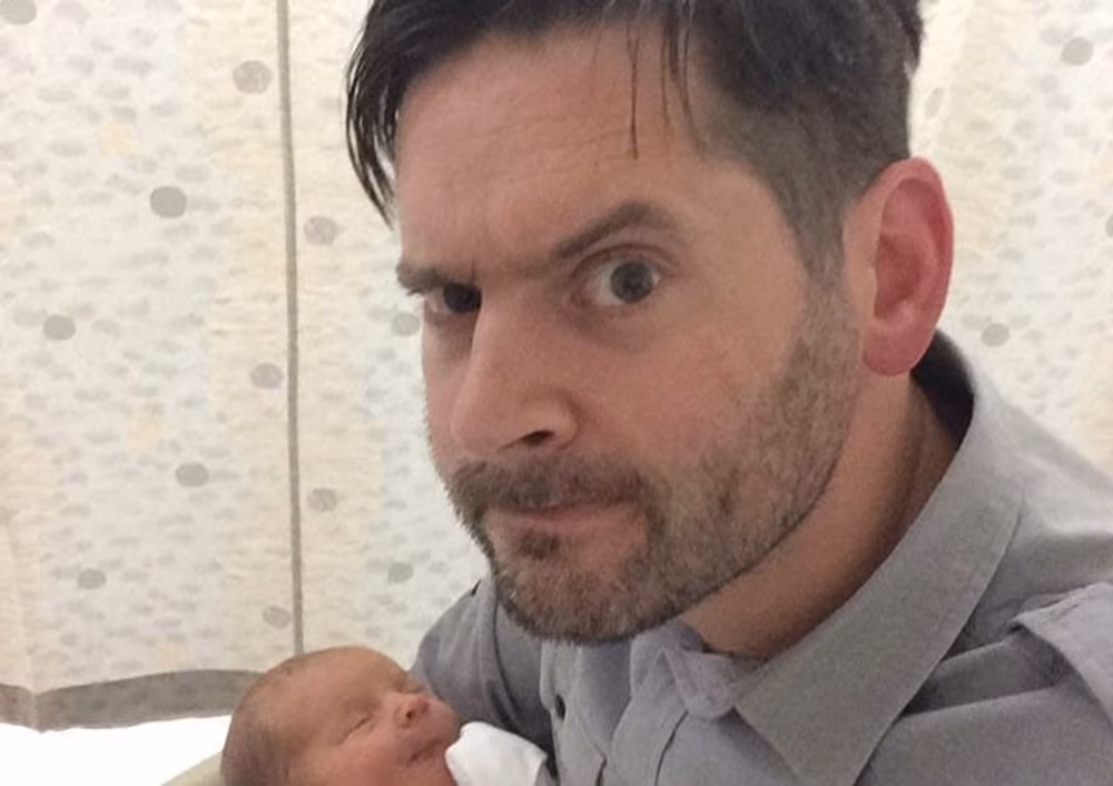 Matt Coyne with newborn baby
