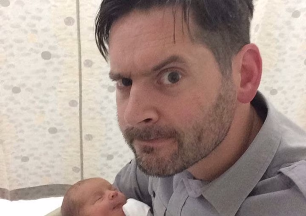 Matt Coyne with newborn baby